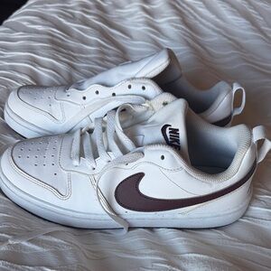 Nike White Low-Top Sneaker with Purple Swoosh